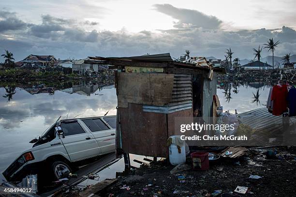 Resident looks out from his home amongst the devastated area in Tacloban City on November 14, 2013 in Leyte, Philippines. Typhoon Haiyan which ripped...