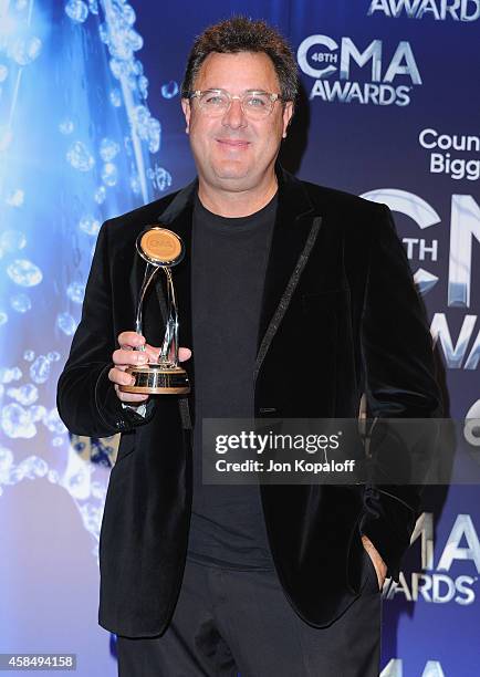 Singer Vince Gill poses in the press room at the 48th annual CMA Awards at the Bridgestone Arena on November 5, 2014 in Nashville, Tennessee.