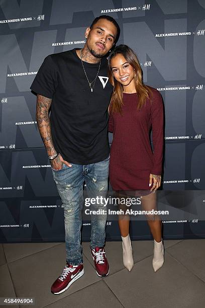 Recording artist Chris Brown and model Karrueche Tran attend the Alexander Wang x H&M Pre-Shop Party at H&M on November 5, 2014 in West Hollywood,...