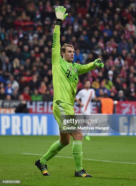 Goalkeeper Manuel Neuer of Muenchen gestures during the UEFA Champions League Group E match between FC Bayern Munchen and AS Roma at Allianz Arena on...