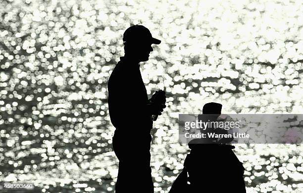 Silhouette of Alessandro Tadini of Italy on the 18th hole during the second round of the Dubai Festival City Challenge Tour Grand Final at Al Badia...