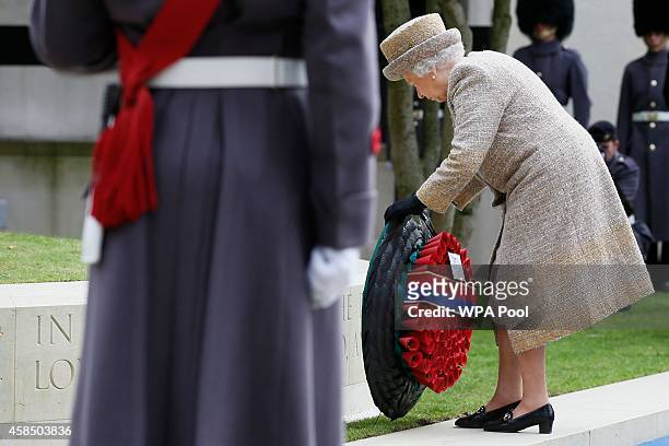 Queen Elizabeth II lays a wreath during the Opening of the Flanders' Fields Memorial Garden at Wellington Barracks on November 6, 2014 in London,...