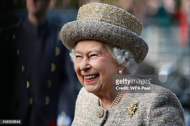 Queen Elizabeth II smiles as she arrives before the Opening of the Flanders' Fields Memorial Garden at Wellington Barracks on November 6, 2014 in...