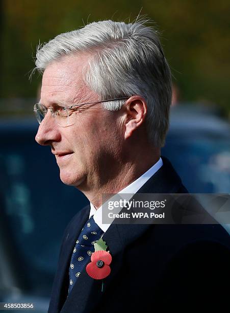 Belgium's King Philippe holds a wreath during the Opening of the Flanders' Fields Memorial Garden at Wellington Barracks on November 6, 2014 in...