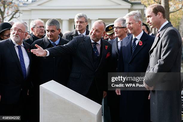 Belgium's King Philippe and Prince William, Duke of Cambridge look at the Flanders' Fields Memorial Garden during its opening at Wellington Barracks...