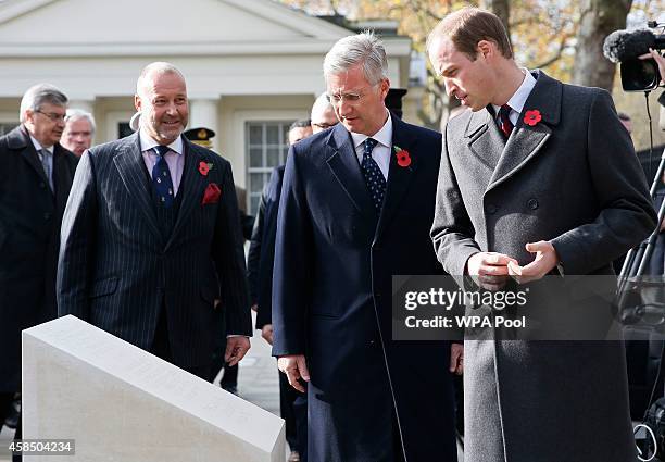 Belgium's King Philippe and Prince William, Duke of Cambridge look at the Flanders' Fields Memorial Garden during its opening at Wellington Barracks...