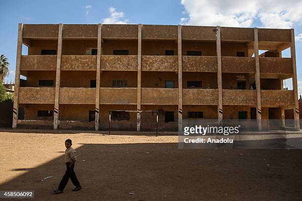 An Egyptian student is seen at the garden of a primary school, where nearly 2 thousand students get education, in Baragil neighborhood of Giza, Egypt...