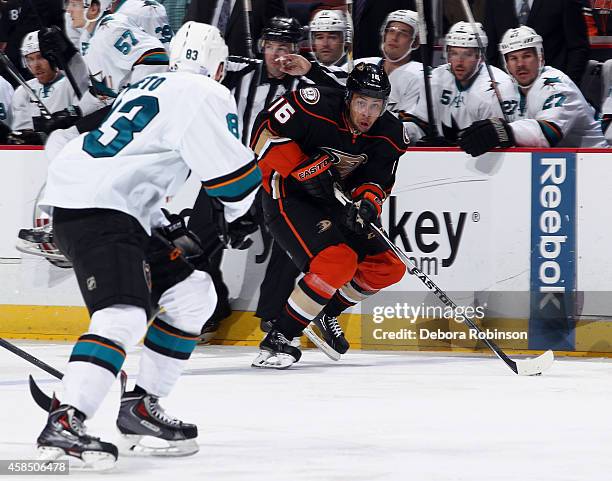 Emerson Etem of the Anaheim Ducks skates against Matt Nieto of the San Jose Sharks on October 26, 2014 at Honda Center in Anaheim, California.