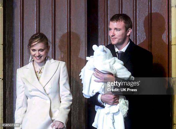 Madonna, and Guy Ritchie, with their son Rocco, at Rocco's Christening Ceremony, at Dornoch Cathedral, in Scotland. On December 21, 2000 in, Dornoch,...