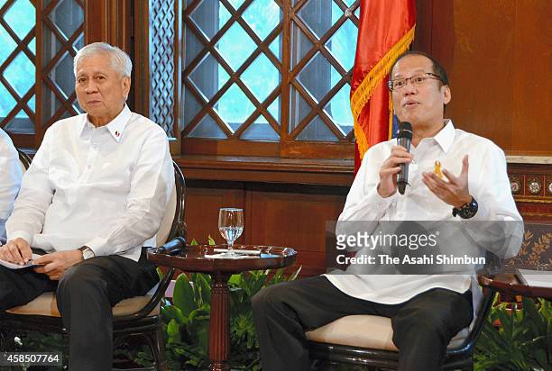 Philippines President Benigno Aquino III and Foreign Minister Albert Del Rosario attend a meeting with Japanese media at the presidential office on...