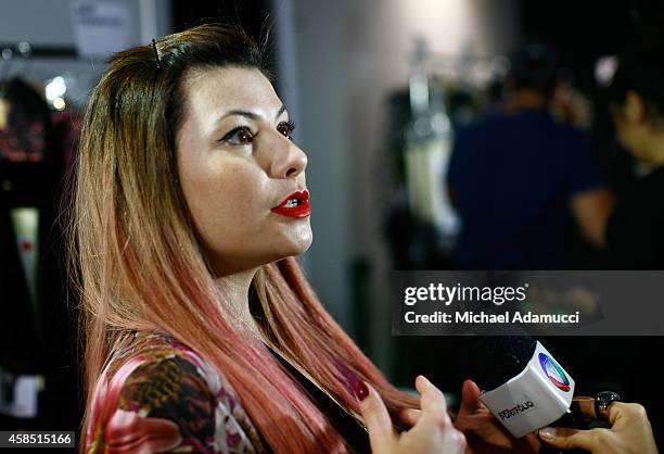 Designer Helo Rocha gives an interview backstage before the Teca por Helo Rocha fashion show during Sao Paulo Fashion Week Winter 2015 at Parque...