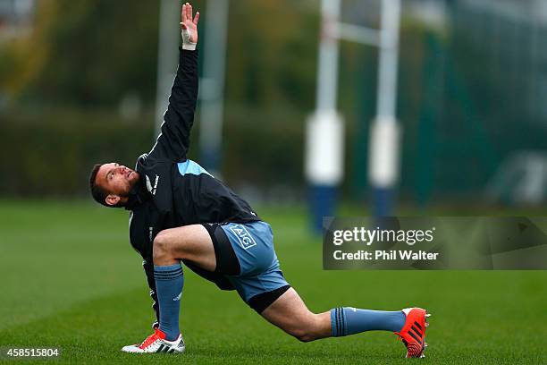 Aaron Cruden of the All Blacks warms up during a New Zealand All Blacks training session at Latymers on November 6, 2014 in London, England.