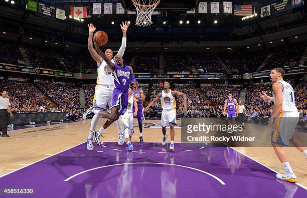 Darren Collison of the Sacramento Kings puts up a shot against Marreese Speights of the Golden State Warriors on October 29, 2014 at Sleep Train...
