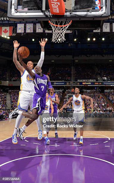 Darren Collison of the Sacramento Kings shoots a layup against Marreese Speights of the Golden State Warriors on October 29, 2014 at Sleep Train...