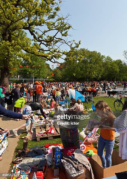 flea market for children in amsterdam during queens day - vondelpark stockfoto's en -beelden