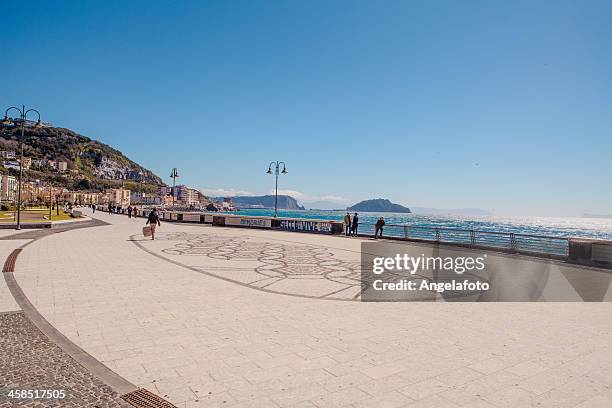 seafront with people walking in pozzuoli, naples, campania, italy, - pozzuoli stock pictures, royalty-free photos & images