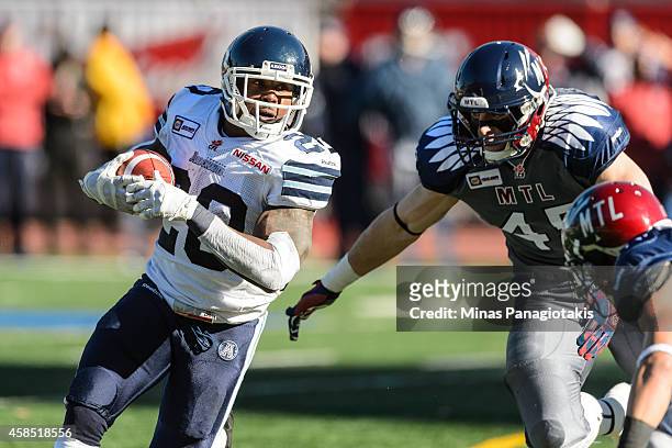 Steve Slaton of the Toronto Argonauts carries the ball during the CFL game against the Montreal Alouettes at Percival Molson Stadium on November 2,...