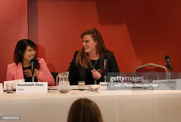 Rochester And Strood by-election candidates Naushabah Khan of the Labour Party and Conservative Kelly Tolhurst sit next to an empty seat reserved for...