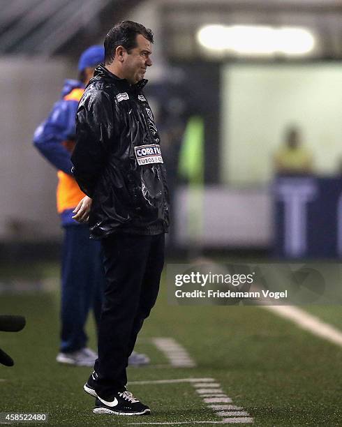 Robinho of Santos is injured during the match between Santos and Cruzeiro for Copa do Brasil 2014 at Vila Belmiro Stadium on November 5, 2014 in...