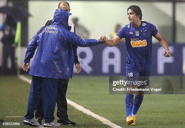 Marcelo Moreno of Cruzeiro celebrates scoring the first goal during the match between Santos and Cruzeiro for Copa do Brasil 2014 at Vila Belmiro...