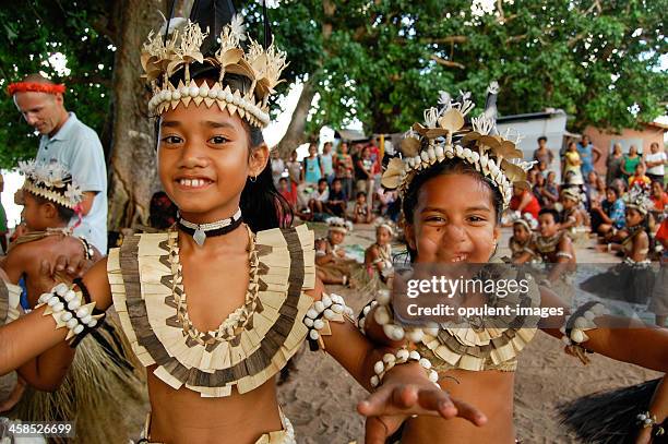 two school children performing traditional dance - fiji stock pictures, royalty-free photos & images