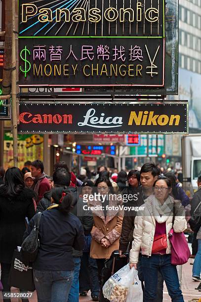 chinese consumers shopping neon signs hong kong - now voyager stock pictures, royalty-free photos & images