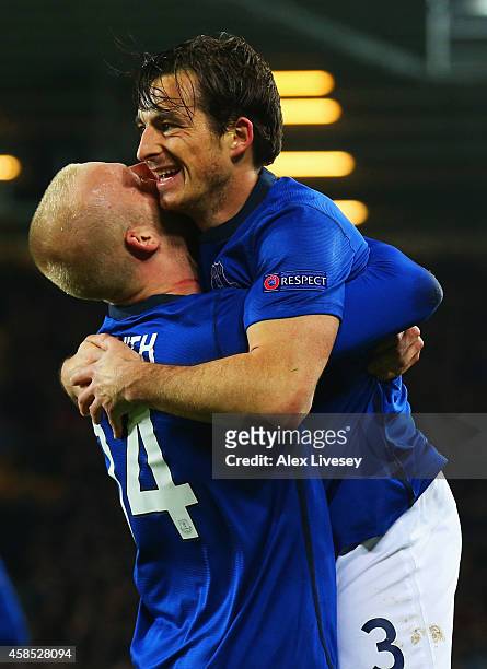 Steven Naismith of Everton celebrates with Leighton Baines as he scores their third goal during the UEFA Europa League Group H match between Everton...