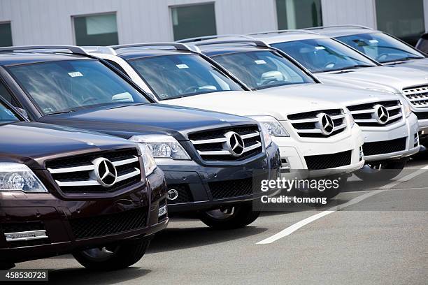 new glk-class mercedes vehicles in a row at car dealership - mercedes benz glk stock pictures, royalty-free photos & images