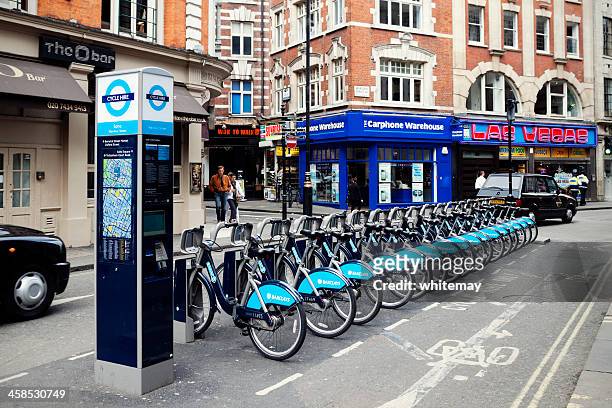 cycle hire in wardour street, london - wardour street stockfoto's en -beelden
