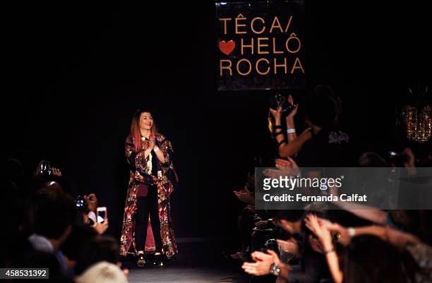 Designer Helo Rocha acknowledges the crowd on the runway at the Teca por Helo Rocha fashion show during Sao Paulo Fashion Week Winter 2015 at Parque...