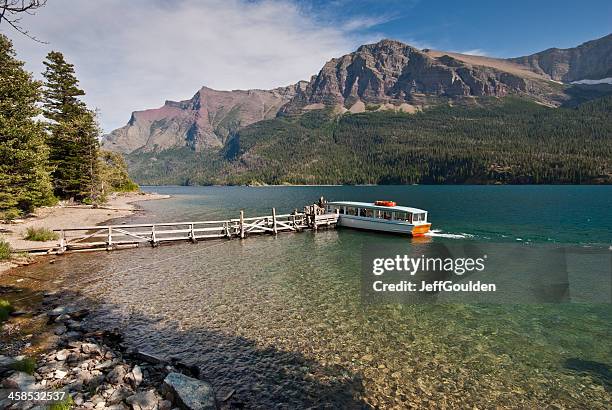 tour boat on saint mary lake - glacier county montana stockfoto's en -beelden