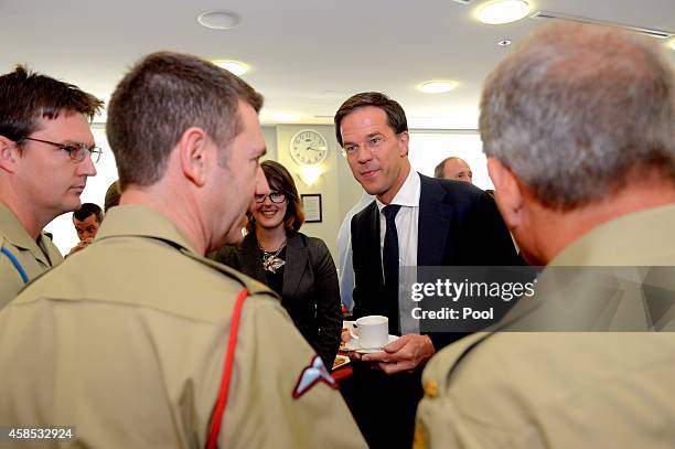 Netherlands Prime Minister Mark Rutte speaks to defence personnel during a visit to the Department of Foreign Affairs Crisis Centre on November 7,...