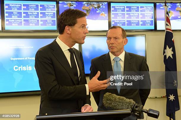 Netherlands Prime Minister Mark Rutte and Australian Prime Minister Tony Abbott during a visit to the Department of Foreign Affairs Crisis Centre on...