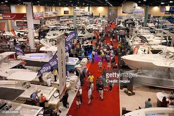 consumers at a boat show. - tradeshow stock pictures, royalty-free photos & images
