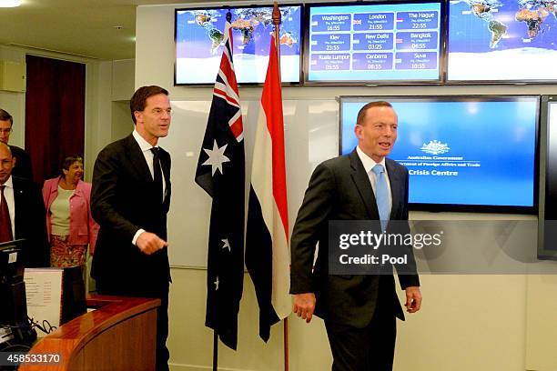 Netherlands Prime Minister Mark Rutte and Australian Prime Minister Tony Abbott visit the Department of Foreign Affairs Crisis Centre on November 7,...