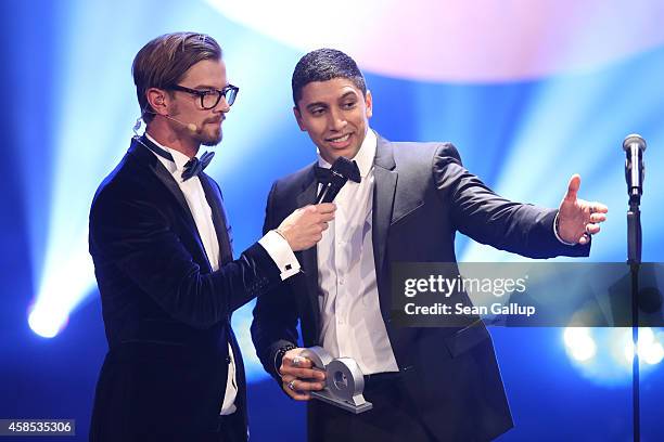 Joko Winterscheidt and Andreas Bourani are seen on stage at the GQ Men Of The Year Award 2014 at Komische Oper on November 6, 2014 in Berlin, Germany.