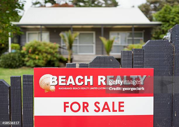 beach property for sale sign - new zealand beach house stock pictures, royalty-free photos & images