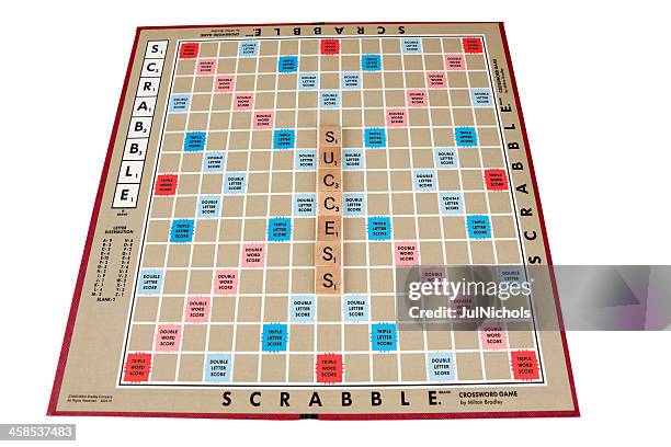 success on a scrabble game board - scrabble stockfoto's en -beelden