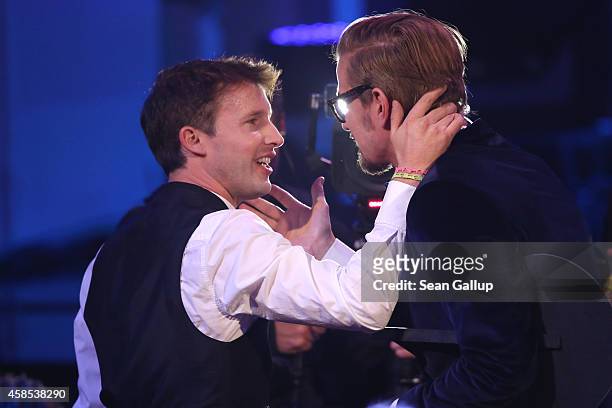 James Blunt and Joko Winterscheidt are seen on stage at the GQ Men Of The Year Award 2014 at Komische Oper on November 6, 2014 in Berlin, Germany.