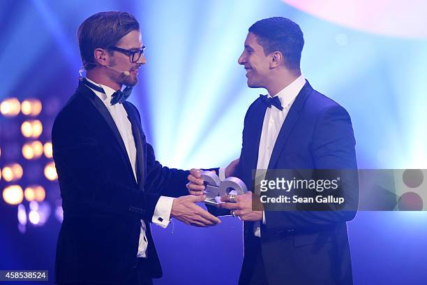Joko Winterscheidt and Andreas Bourani are seen on stage at the GQ Men Of The Year Award 2014 at Komische Oper on November 6, 2014 in Berlin, Germany.