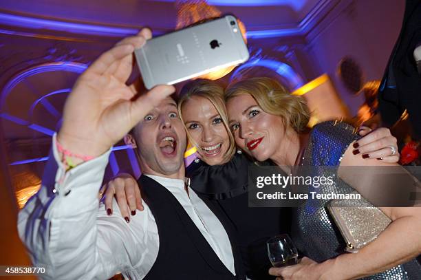 James Blunt , guest and Sanny van Heteren is seen at the after show party of the GQ Men Of The Year Award 2014 after show party at Komische Oper on...