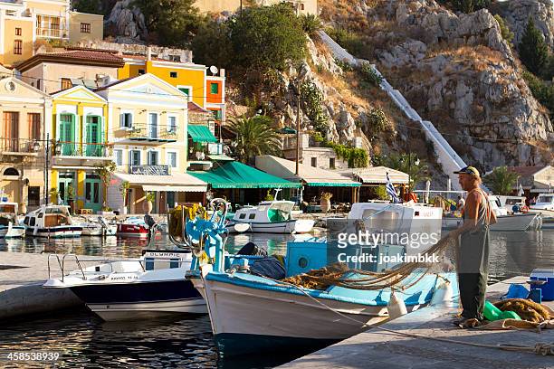 greek fisherman - symi stock pictures, royalty-free photos & images
