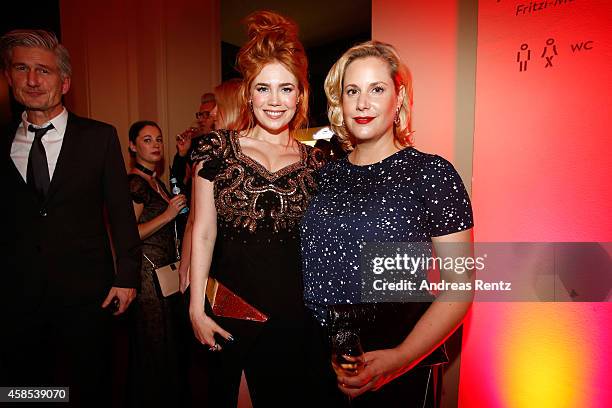 Palina Rojinski and Anika Decker arrive at the GQ Men of the Year Award 2014 at Komische Oper on November 6, 2014 in Berlin, Germany.