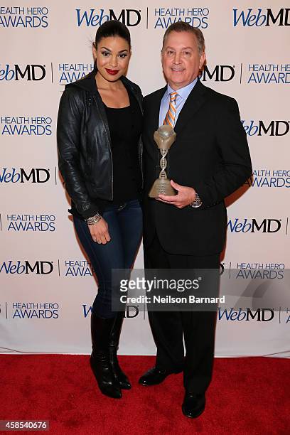 Musician Jordin Sparks and Honoree Dr. Frank Papay pose with an award backstage at the 2014 Health Hero Awards hosted by WebMD at Times Center on...