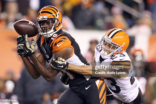 Green of the Cincinnati Bengals drops a pass while being defended by Joe Haden of the Cleveland Browns during the third quarter at Paul Brown Stadium...