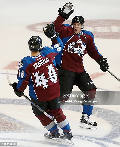 Matt Duchene of the Colorado Avalanche celebrates with Alex Tanguay of the Colorado Avalanche after Tanguay scored the game winning goal against...