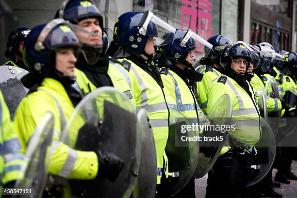 riot police line, london. - police in riot gear stock pictures, royalty-free photos & images