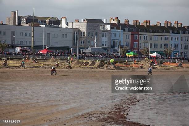 motorcycle motocross dirt bike race on the beach at weymouth - weymouth esplanade stock pictures, royalty-free photos & images