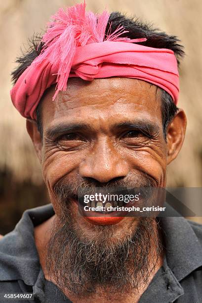 man with traditional turban at funeral ceremony in sumba, indonesia - sumba stock pictures, royalty-free photos & images