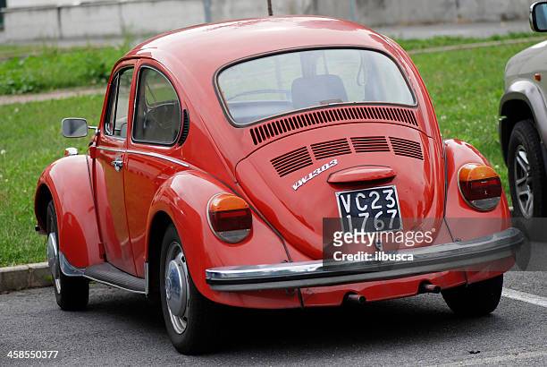 old red volkswagen beetle in the street - vw beetle stock pictures, royalty-free photos & images